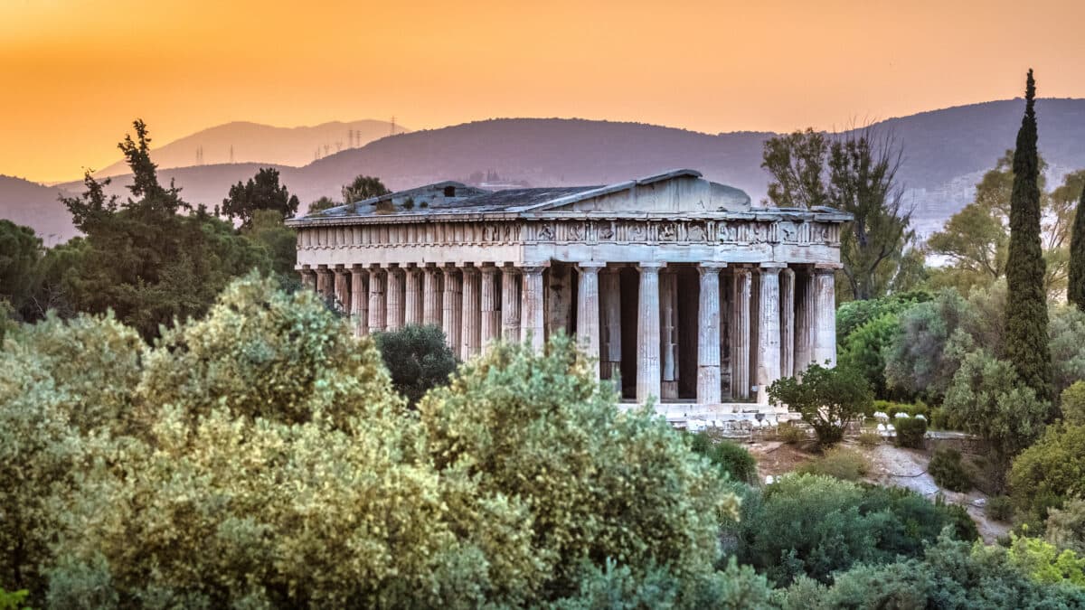 Ancient Agora of Athens with Temple of Hephaestus at sunset, Greek historical site and archaeological wonder.