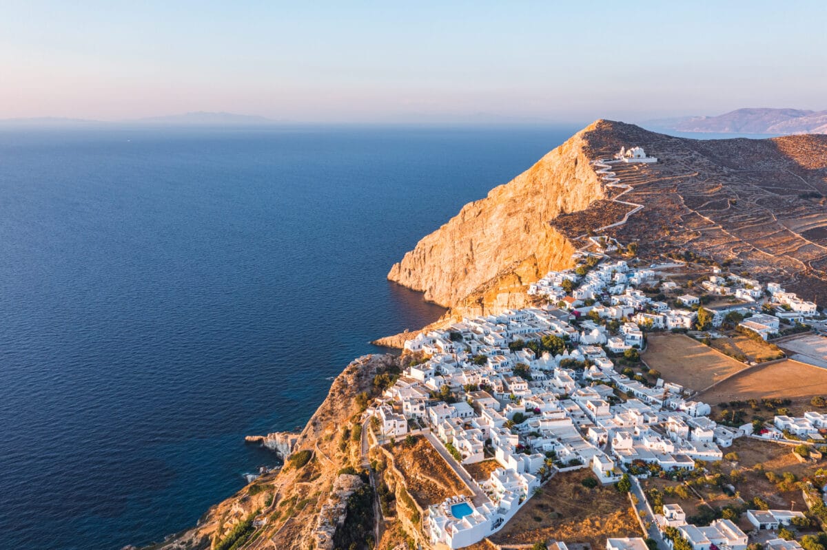 Aerial sunset view of Hora village and Panagia Church on Folegandros Island, Cyclades, Greece.