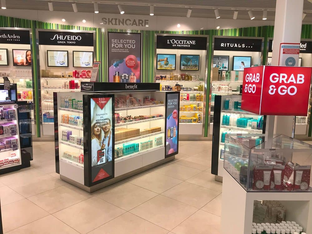 Hellenic Duty Free Shops skincare retail store with branded displays, digital signage, and Grab & Go products.