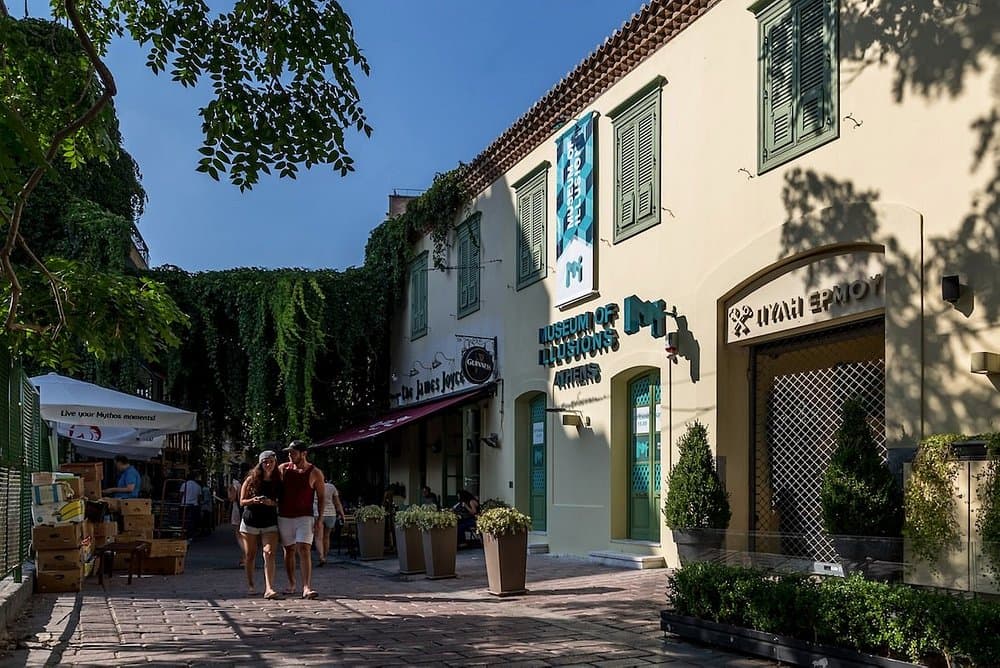 Museum of Illusions Athens building and Historic Athens street with cobblestones