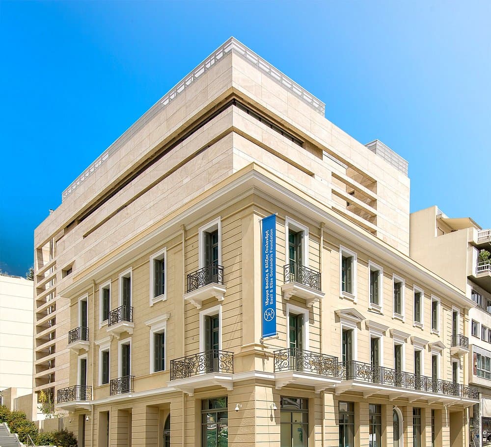 Basil & Elise Goulandris Foundation modern and classic European-style building with office banners in an upscale urban setting.